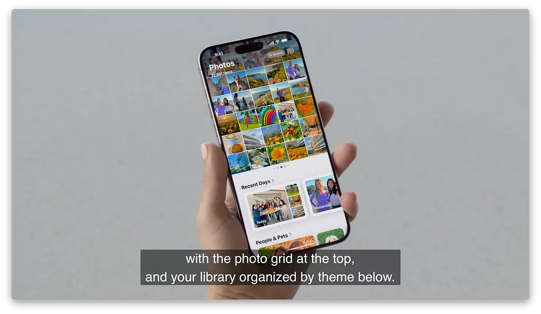 图片展示了一只手握着iPhone,屏幕上显示照片应用界面。上方是照片网格,呈现多张不同场景的照片缩略图。下方有“Recent Days”和“People & Pets”两个分类,分别展示了最近几天和人物与宠物的照片。图片下方文字说明“with the photo grid at the top, and your library organized by theme below.”,与上下文介绍照片应用重新设计,基于主题、人物和旅行的收藏显示在照片网格下方的内容相呼应。