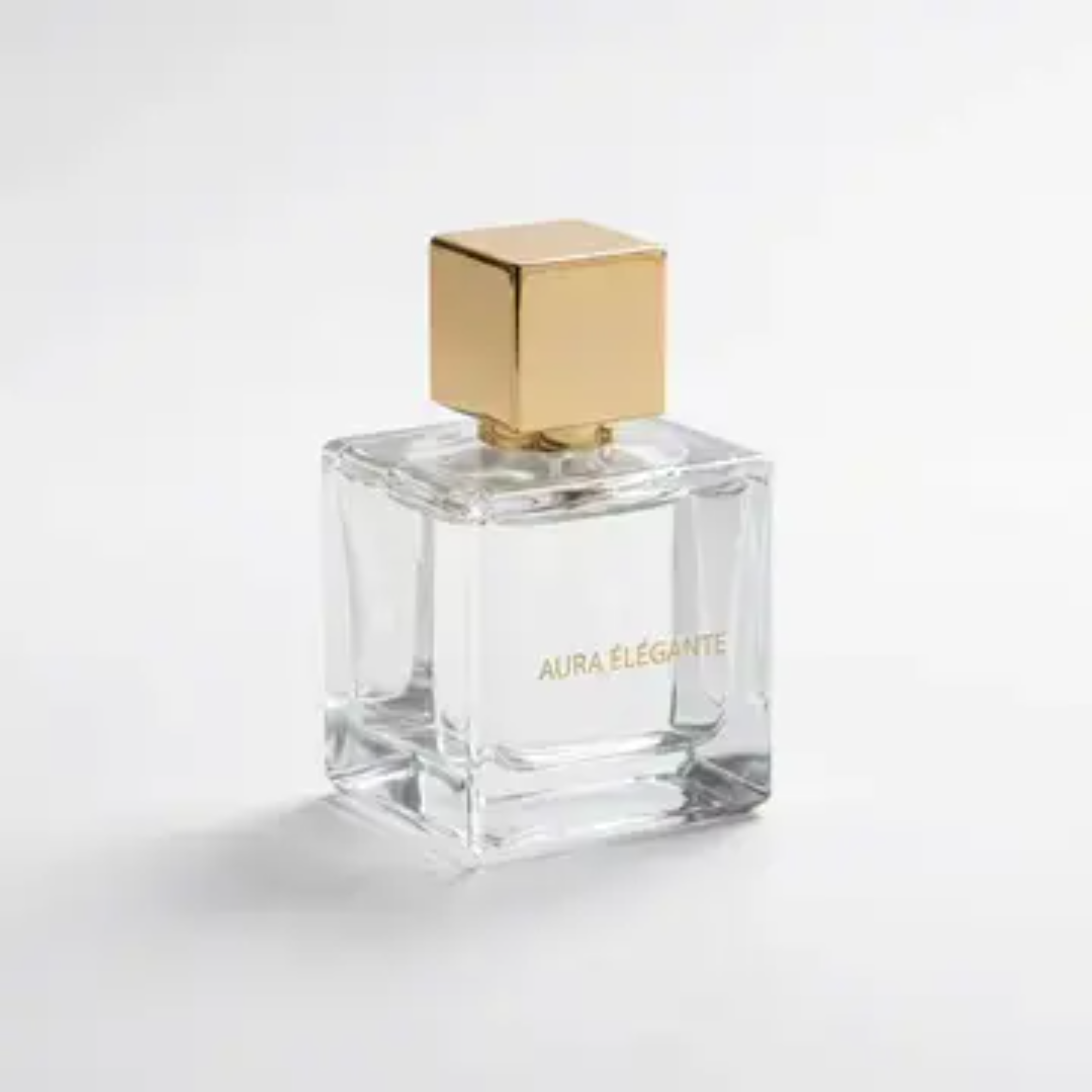 图片展示了一瓶香水。瓶身为透明玻璃材质,呈立方体形状,瓶盖为金色方形。瓶身正面印有“AURA ELEGANTE”字样,字体为白色。背景为纯白色,瓶身置于白色底面上,整体设计简洁优雅,突显出香水的高端质感。该图片可能用于展示产品外观,与文档中提及的视频制作效果可控性相关,体现产品呈现的精细度。